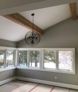 A room with windows and frames on the ceiling